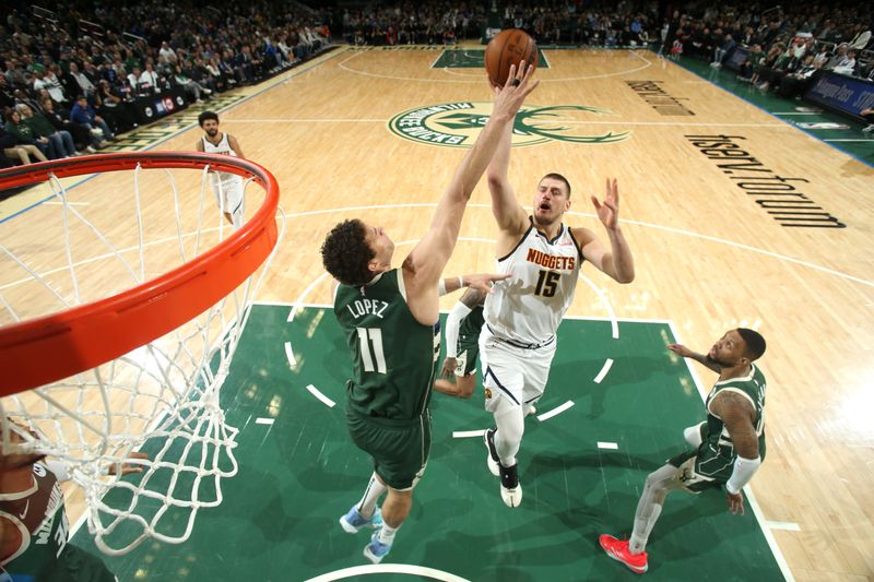 MILWAUKEE, WI - FEBRUARY 27: Nikola Jokic #15 of the Denver Nuggets shoots the ball during the game against the Milwaukee Bucks on February 27, 2025 at Fiserv Forum Center in Milwaukee, Wisconsin. NOTE TO USER: User expressly acknowledges and agrees that, by downloading and or using this Photograph, user is consenting to the terms and conditions of the Getty Images License Agreement. Mandatory Copyright Notice: Copyright 2025 NBAE (Photo by Gary Dineen/NBAE via Getty Images).