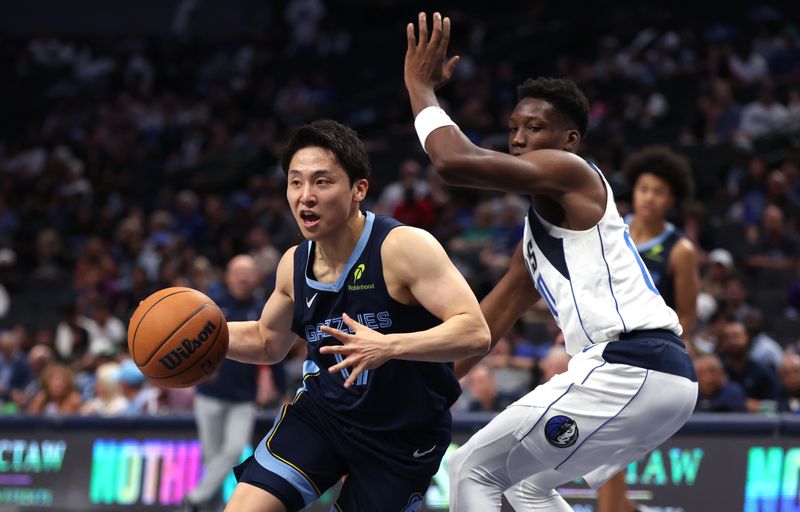 DALLAS, TX - OCTOBER 7: Yuki Kawamura #17 of the Memphis Grizzlies handles the ball as Jazian Gortman #00 of the Dallas Mavericks defends in the second half of a preseason game at American Airlines Center on October 7, 2024 in Dallas, Texas. NOTE TO USER: User expressly acknowledges and agrees that, by downloading and or using this photograph, User is consenting to the terms and conditions of the Getty Images License Agreement. (Photo by Ron Jenkins/Getty Images)