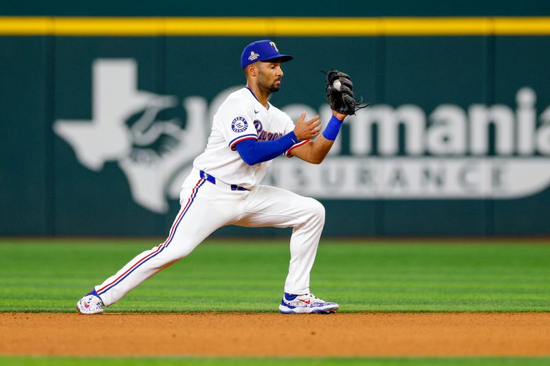 Jun 4, 2024; Arlington, Texas, USA; Texas Rangers second base Marcus Semien (2) makes a play on a ground ball during the fourth inning against the Detroit Tigers at Globe Life Field. Mandatory Credit: Andrew Dieb-USA TODAY Sports