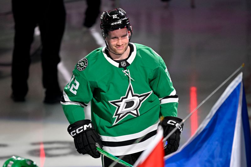 Feb 4, 2026; Dallas, Texas, USA; Dallas Stars center Radek Faksa (12) takes the ice as the Stars celebrate their 2026 Winter Olympics hockey players before the game against the St. Louis Blues at the American Airlines Center. Mandatory Credit: Jerome Miron-Imagn Images