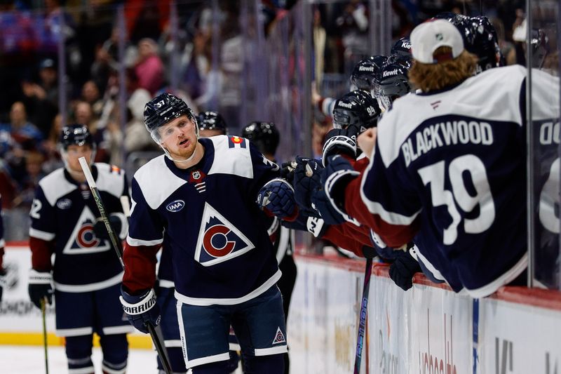 Jan 18, 2025; Denver, Colorado, USA; Colorado Avalanche center Casey Mittelstadt (37) celebrates with the bench after his goal in the first period against the Dallas Stars at Ball Arena. Mandatory Credit: Isaiah J. Downing-Imagn Images