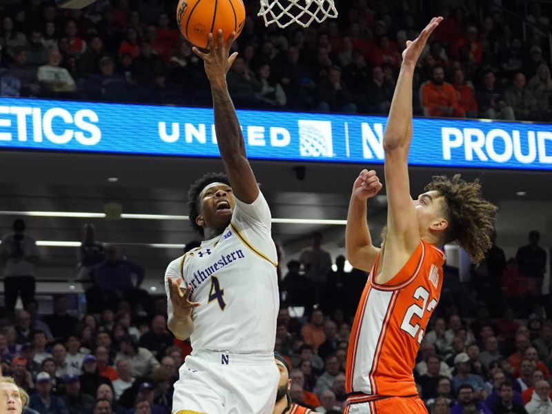 Jan 14, 2026; Evanston, Illinois, USA; Illinois Fighting Illini guard Keaton Wagler (23) defends Northwestern Wildcats guard Jayden Reid (4) during the second half at Welsh-Ryan Arena. Mandatory Credit: David Banks-Imagn Images