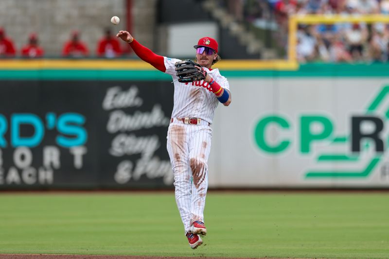 Mar 15, 2026; Clearwater, Florida, USA; Philadelphia Phillies second baseman Bryson Stott (5) trows to first for an out against the Atlanta Braves in the third inning during spring training at BayCare Ballpark. Mandatory Credit: Nathan Ray Seebeck-Imagn Images