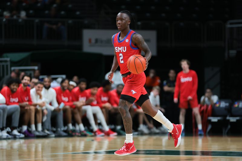 Jan 18, 2025; Coral Gables, Florida, USA; Southern Methodist Mustangs guard Boopie Miller (2) dribbles the basketball against the Miami Hurricanes during the first half at Watsco Center. Mandatory Credit: Sam Navarro-Imagn Images