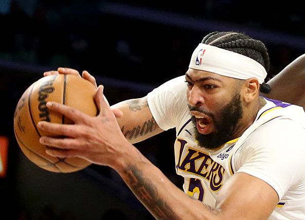 Los Angeles, CA - Lakers power forward Anthony Davis pulls down a rebound against the Celtics at Crypto.com Arena in Los Angeles on Christmas Day, Dec. 25, 2023. (Luis Sinco / Los Angeles Times via Getty Images)