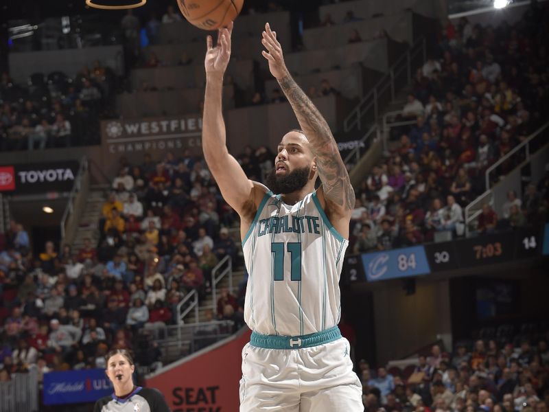 CLEVELAND, OH - NOVEMBER 17: Cody Martin #11 of the Charlotte Hornets shoots the ball during the game against the Cleveland Cavaliers on November 17, 2024 at Rocket Mortgage FieldHouse in Cleveland, Ohio. NOTE TO USER: User expressly acknowledges and agrees that, by downloading and/or using this Photograph, user is consenting to the terms and conditions of the Getty Images License Agreement. Mandatory Copyright Notice: Copyright 2024 NBAE (Photo by David Liam Kyle/NBAE via Getty Images)