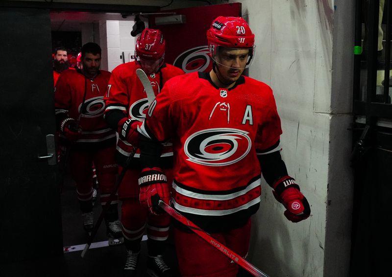 Nov 26, 2023; Raleigh, North Carolina, USA; Carolina Hurricanes center Sebastian Aho (20) goes out for the warmups against the Columbus Blue Jackets at PNC Arena. Mandatory Credit: James Guillory-USA TODAY Sports