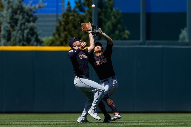 May 27, 2024; Denver, Colorado, USA; Cleveland Guardians left fielder David Fry (6) makes a catch ahead of center fielder Tyler Freeman (2) in the third inning against the Colorado Rockies at Coors Field. Mandatory Credit: Isaiah J. Downing-USA TODAY Sports