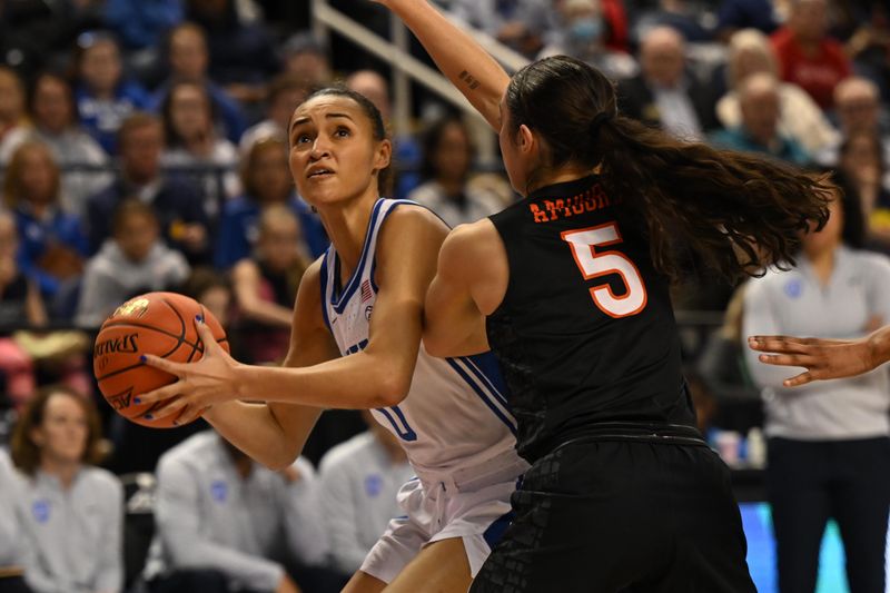 Mar 4, 2023; Greensboro, NC, USA; Duke Blue Devils guard Celeste Taylor (0) shoots the ball against Virginia Tech Hokies guard Georgia Amoore (5) during the second half at Greensboro Coliseum. Mandatory Credit: William Howard-USA TODAY Sports