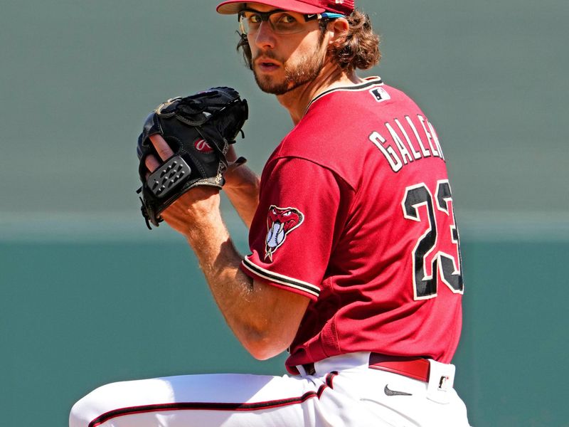 Mar 24, 2023; Scottsdale, AZ, USA; Arizona Diamondbacks starting pitcher Zac Gallen (23) warms-up against the Cincinnati Reds in the first inning during a spring training game at Salt River Fields. Mandatory Credit: Rob Schumacher-Arizona Republic via USA TODAY Sports