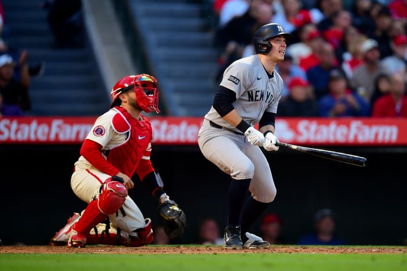 May 27, 2025; Anaheim, California, USA; New York Yankees designated hitter Ben Rice (22) hits a solo home run against the Los Angeles Angels during the fourth inning at Angel Stadium. Mandatory Credit: Gary A. Vasquez-Imagn Images