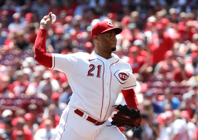 Aug 20, 2023; Cincinnati, Ohio, USA; Cincinnati Reds starting pitcher Hunter Greene (21) throws against the Toronto Blue Jays during the first inning at Great American Ball Park. Mandatory Credit: David Kohl-USA TODAY Sports