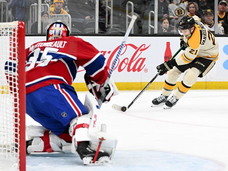 Jan 20, 2024; Boston, Massachusetts, USA; Boston Bruins left wing James van Riemsdyk (21) skates to the net against Montreal Canadiens goaltender Sam Montembeault (35) during the first period at the TD Garden. Mandatory Credit: Brian Fluharty-USA TODAY Sports