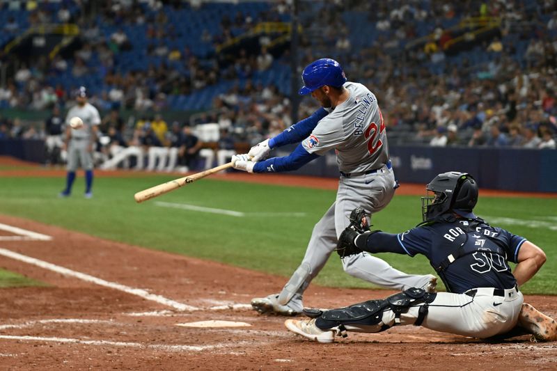 Jun 12, 2024; St. Petersburg, Florida, USA; Chicago Cubs right fielder Cody Bellinger (24) hits a three run home run in the seventh inning against the Tampa Bay Rays at Tropicana Field. Mandatory Credit: Jonathan Dyer-USA TODAY Sports