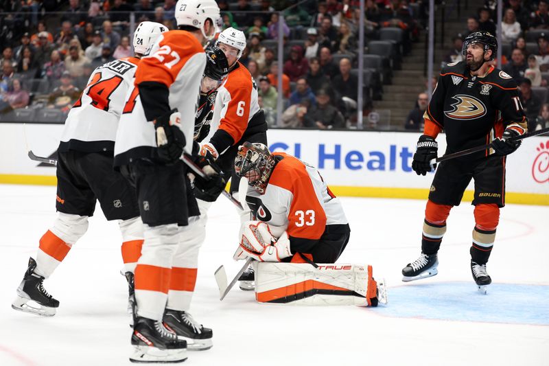 Nov 10, 2023; Anaheim, California, USA; Philadelphia Flyers goaltender Samuel Ersson (33) blocks a shot during the second period against the Anaheim Ducks at Honda Center. Mandatory Credit: Kiyoshi Mio-USA TODAY Sports