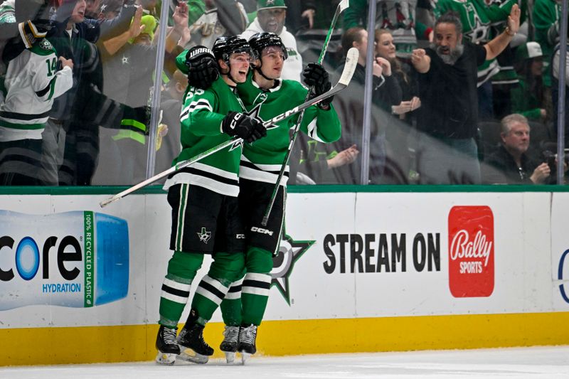 Dec 21, 2023; Dallas, Texas, USA; Dallas Stars defenseman Thomas Harley (55) and center Roope Hintz (24) celebrate after Harley scores the game tying goal against the Vancouver Canucks during the third period at the American Airlines Center. Mandatory Credit: Jerome Miron-USA TODAY Sports