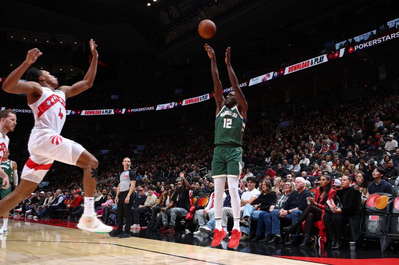 TORONTO, CANADA - JANUARY 6: Taurean Prince #12 of the Milwaukee Bucks shoots a three point basket during the game against the Toronto Raptors on January 6, 2025 at the Scotiabank Arena in Toronto, Ontario, Canada.  NOTE TO USER: User expressly acknowledges and agrees that, by downloading and or using this Photograph, user is consenting to the terms and conditions of the Getty Images License Agreement.  Mandatory Copyright Notice: Copyright 2025 NBAE (Photo by Vaughn Ridley/NBAE via Getty Images)