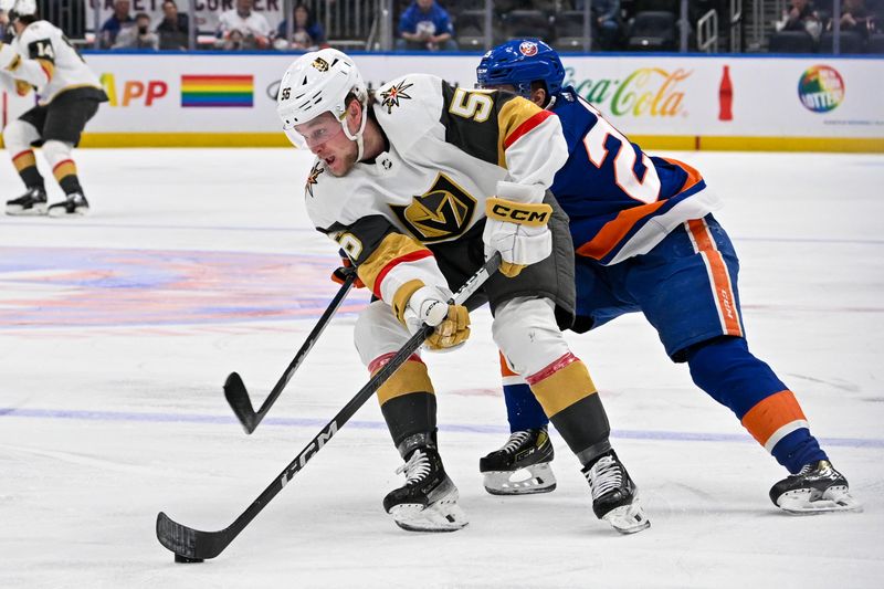 Jan 23, 2024; Elmont, New York, USA;  New York Islanders defenseman Sebastian Aho (25) chases Vegas Golden Knights right wing Sheldon Rempal (56) during the first period at UBS Arena. Mandatory Credit: Dennis Schneidler-USA TODAY Sports