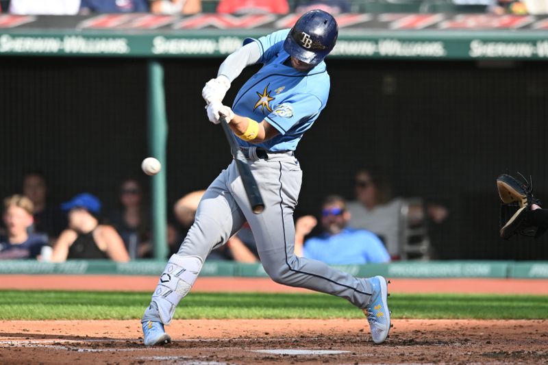 Sep 3, 2023; Cleveland, Ohio, USA; Tampa Bay Rays second baseman Brandon Lowe (8) hits a single during the fourth inning against the Cleveland Guardians at Progressive Field. Mandatory Credit: Ken Blaze-USA TODAY Sports