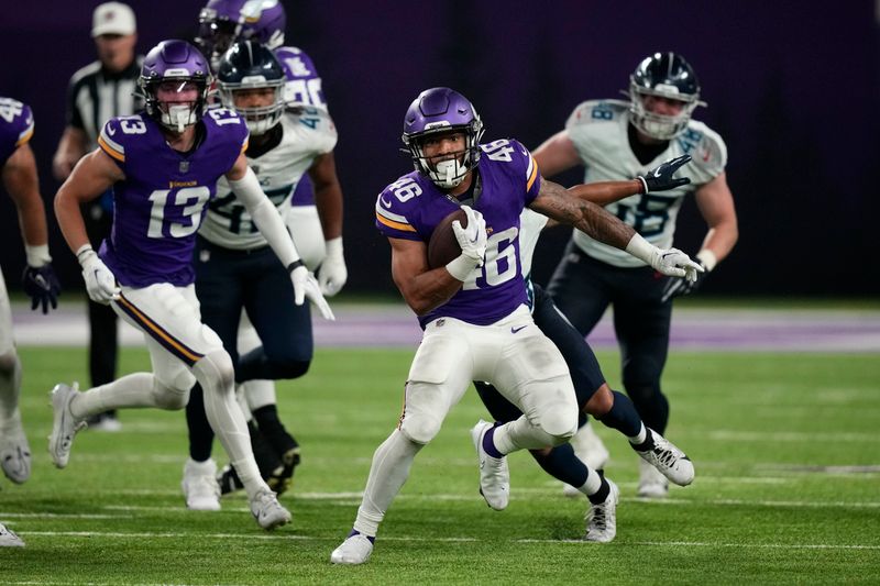 Minnesota Vikings running back Aaron Dykes (46) carries the ball up field during the second half of an NFL football game against the Tennessee Titans, Saturday, Aug. 19, 2023, in Minneapolis. (AP Photo/Charlie Neibergall)