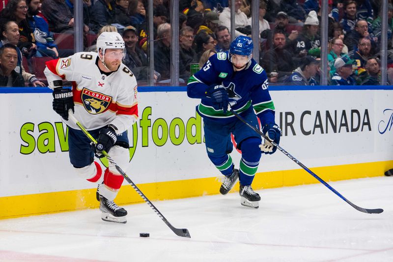 Dec 14, 2023; Vancouver, British Columbia, CAN; Vancouver Canucks forward Ilya Mikheyev (65) skates after Florida Panthers forward Sam Bennett (9) in the second period at Rogers Arena. Vancouver won 4-0. Mandatory Credit: Bob Frid-USA TODAY Sports