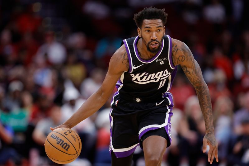 HOUSTON, TEXAS - NOVEMBER 06: Malik Monk #0 of the Sacramento Kings controls the ball against the Houston Rockets during the first half at Toyota Center on November 06, 2023 in Houston, Texas. (Photo by Carmen Mandato/Getty Images)