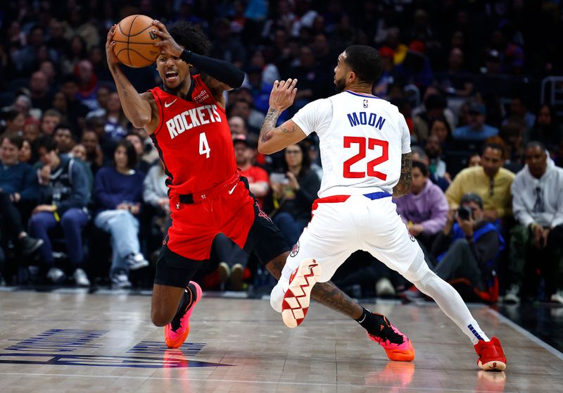 LOS ANGELES, CALIFORNIA - APRIL 14: Jalen Green #4 of the Houston Rockets controls the ball against Xavier Moon #22 of the LA Clippers in the first half at Crypto.com Arena on April 14, 2024 in Los Angeles, California.  NOTE TO USER: User expressly acknowledges and agrees that, by downloading and/or using this photograph, user is consenting to the terms and conditions of the Getty Images License Agreement.  (Photo by Ronald Martinez/Getty Images)