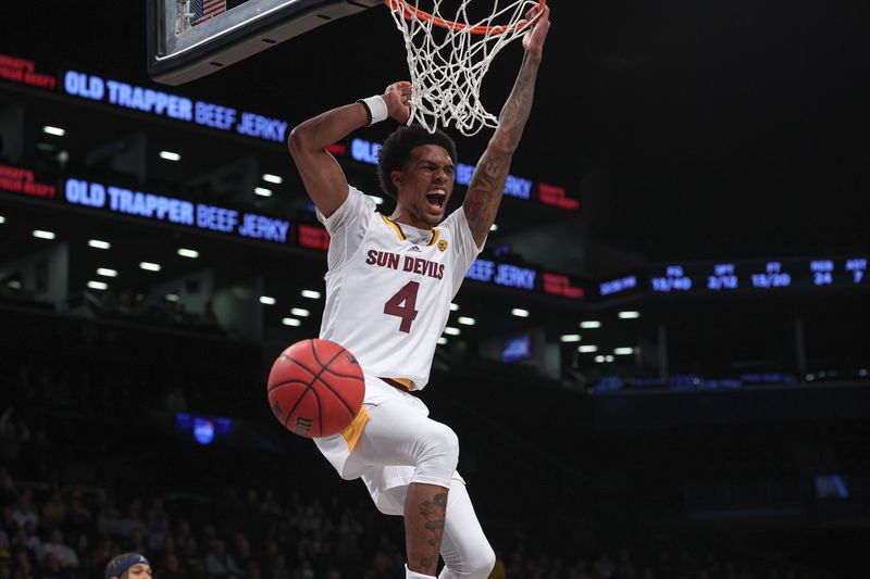 Nov 17, 2022; Brooklyn, New York, USA; Arizona State Sun Devils guard Desmond Cambridge Jr. (4) dunks the ball during the second half against the Michigan Wolverines at Barclays Center. Mandatory Credit: Vincent Carchietta-USA TODAY Sports