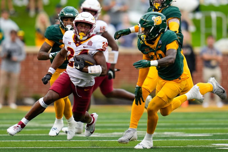 Oct 28, 2023; Waco, Texas, USA;  Iowa State Cyclones running back Abu Sama III (24) runs the ball against Baylor Bears safety Devyn Bobby (28) during the first half at McLane Stadium. Mandatory Credit: Chris Jones-USA TODAY Sports