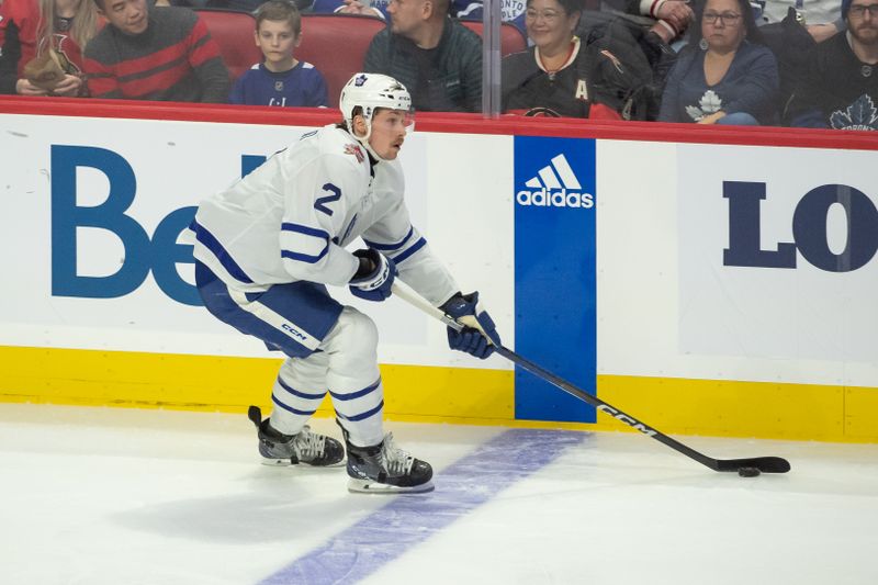 Dec 7, 2023; Ottawa, Ontario, CAN; Toronto Maple Leafs defenseman Simon Benoit (2) skates with the puck in the third period against the Ottawa Senators at the Canadian Tire Centre. Mandatory Credit: Marc DesRosiers-USA TODAY Sports