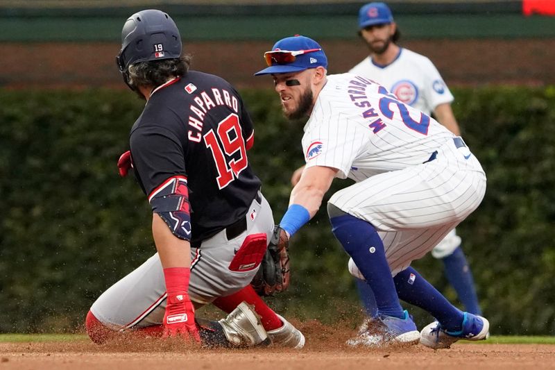Sep 22, 2024; Chicago, Illinois, USA; Washington Nationals third base Andrés Chaparro (19) slides safely into second base with a double as Chicago Cubs second baseman Miles Mastrobuoni (20) makes a late tag during the sixth inningat Wrigley Field. Mandatory Credit: David Banks-Imagn Images