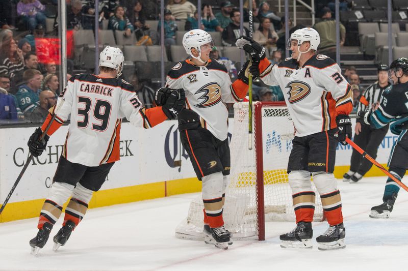 Feb 29, 2024; San Jose, California, USA; Anaheim Ducks center Sam Carrick (39) , center Isac Lundestrom (21) and right wing Jakob Silfverberg (33) celebrate during the third period against the San Jose Sharks at SAP Center at San Jose. Mandatory Credit: Stan Szeto-USA TODAY Sports