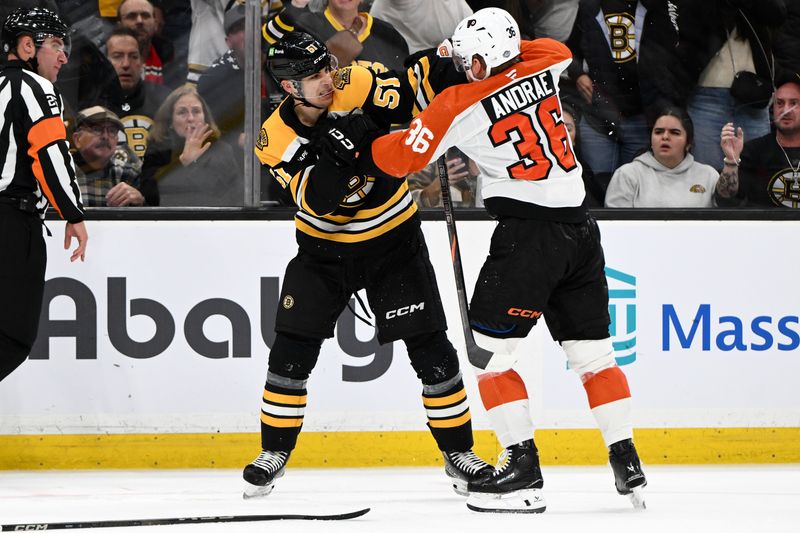 Oct 29, 2024; Boston, Massachusetts, USA; Boston Bruins center Matthew Poitras (51) fights Philadelphia Flyers defenseman Emil Andrae (36) during the third period at TD Garden. Mandatory Credit: Brian Fluharty-Imagn Images