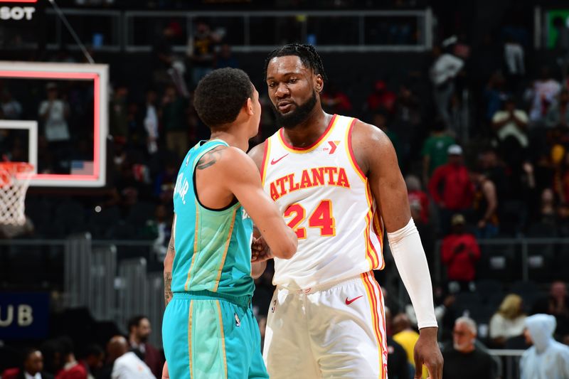 ATLANTA, GA - MARCH 23: Nick Smith Jr. #8 of the Charlotte Hornets and Bruno Fernando #24 of the Atlanta Hawks embrace after the game on March 23, 2024 at State Farm Arena in Atlanta, Georgia.  NOTE TO USER: User expressly acknowledges and agrees that, by downloading and/or using this Photograph, user is consenting to the terms and conditions of the Getty Images License Agreement. Mandatory Copyright Notice: Copyright 2024 NBAE (Photo by Scott Cunningham/NBAE via Getty Images)