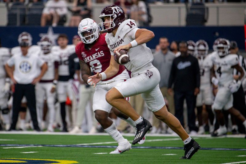 Sep 30, 2023; Arlington, Texas, USA; Texas A&M Aggies quarterback Max Johnson (14) runs past Arkansas Razorbacks defensive back Jayden Johnson (8) during the second half at AT&T Stadium. Mandatory Credit: Jerome Miron-USA TODAY Sports