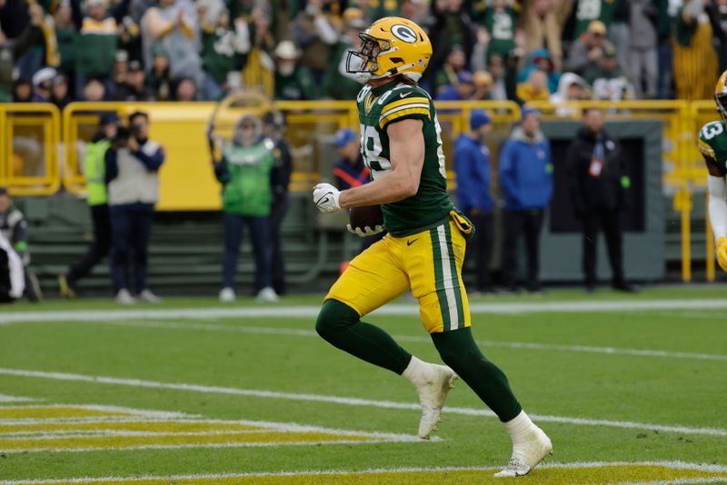 Green Bay Packers tight end Luke Musgrave (88) celebrates after scoring a 20-yard touchdown during the second half of an NFL football game against the Los Angeles Rams, Sunday, Nov. 5, 2023, in Green Bay, Wis. (AP Photo/Mike Roemer)