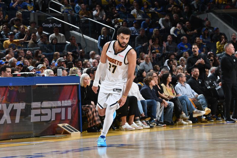 SAN FRANCISCO, CA - FEBRUARY 25: Jamal Murray #27 of the Denver Nuggets looks on during the game against the Golden State Warriors on February 25, 2024 at Chase Center in San Francisco, California. NOTE TO USER: User expressly acknowledges and agrees that, by downloading and or using this photograph, user is consenting to the terms and conditions of Getty Images License Agreement. Mandatory Copyright Notice: Copyright 2024 NBAE (Photo by Noah Graham/NBAE via Getty Images)