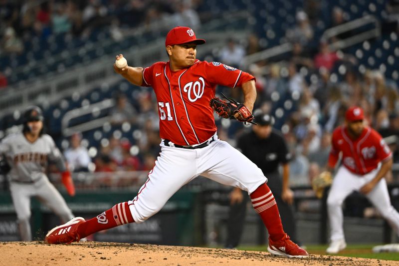 Jun 6, 2023; Washington, District of Columbia, USA; Washington Nationals relief pitcher Erasmo Ramirez (61) throws to the Arizona Diamondbacks during the fifth inning at Nationals Park. Mandatory Credit: Brad Mills-USA TODAY Sports