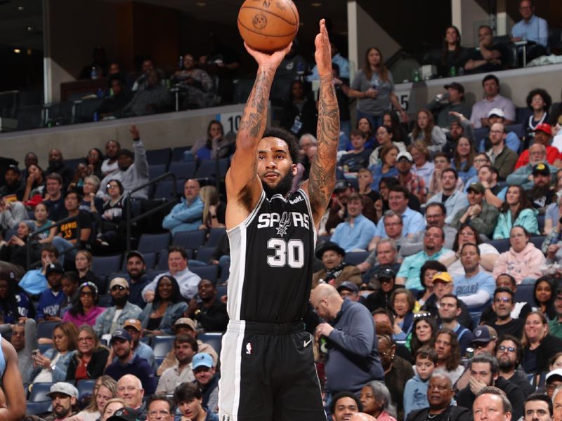 MEMPHIS, TN - APRIL 9: Julian Champagnie #30 of the San Antonio Spurs shoots a three point basket against the Memphis Grizzlies on April 9, 2024 at FedExForum in Memphis, Tennessee. NOTE TO USER: User expressly acknowledges and agrees that, by downloading and or using this photograph, User is consenting to the terms and conditions of the Getty Images License Agreement. Mandatory Copyright Notice: Copyright 2024 NBAE (Photo by Joe Murphy/NBAE via Getty Images)