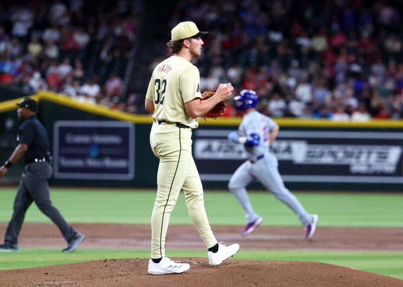 Aug 27, 2024; Phoenix, Arizona, USA; Arizona Diamondbacks pitcher Brandon Pfaadt reacts after giving up a home run to New York Mets first baseman Pete Alonso in the second inning at Chase Field. Mandatory Credit: Mark J. Rebilas-USA TODAY Sports