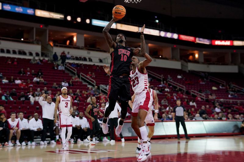 Feb 14, 2024; Fresno, California, USA; UNLV Rebels forward Kalib Boone (10) makes a shot while being fouled by Fresno State Bulldogs guard Leo Colimerio (23) in the first half at the Save Mart Center. Mandatory Credit: Cary Edmondson-USA TODAY Sports