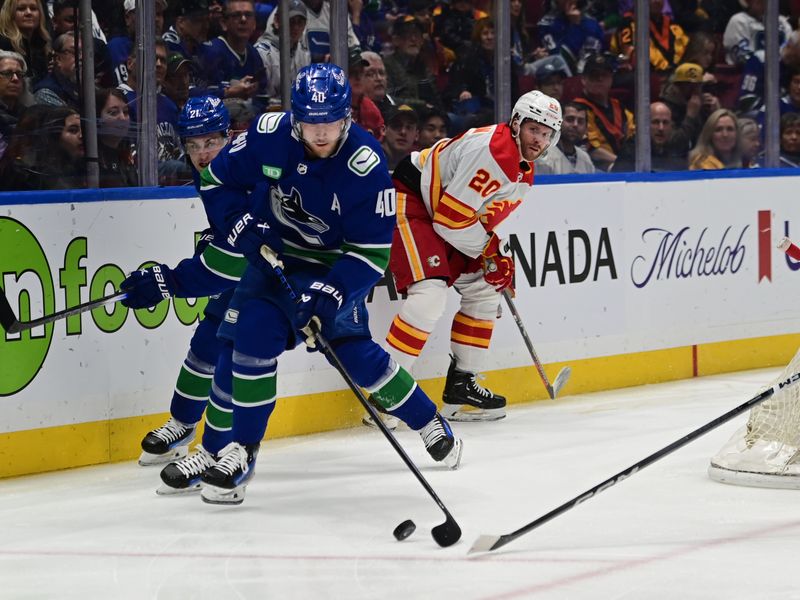 Mar 23, 2024; Vancouver, British Columbia, CAN; Vancouver Canucks forward Elias  Pettersson (40) controls the puck against the Calgary Flames during the first period at Rogers Arena. Mandatory Credit: Simon Fearn-USA TODAY Sports