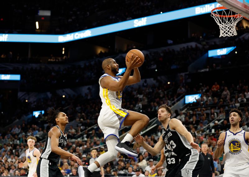 SAN ANTONIO, TX - MARCH 11: Chris Paul #3 of the Golden State Warriors drives past Zach Collins #23 of the San Antonio Spurs in the second half at Frost Bank Center on March 11, 2024 in San Antonio, Texas. NOTE TO USER: User expressly acknowledges and agrees that, by downloading and or using this photograph, User is consenting to terms and conditions of the Getty Images License Agreement. (Photo by Ronald Cortes/Getty Images)