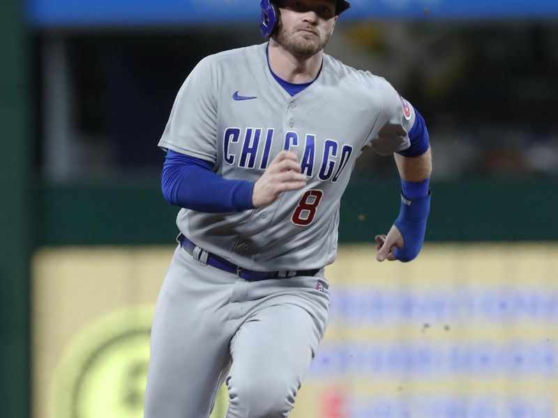 Aug 26, 2023; Pittsburgh, Pennsylvania, USA;  Chicago Cubs left fielder Ian Happ (8) runs from first to third base against the Pittsburgh Pirates during the ninth inning at PNC Park. Mandatory Credit: Charles LeClaire-USA TODAY Sports