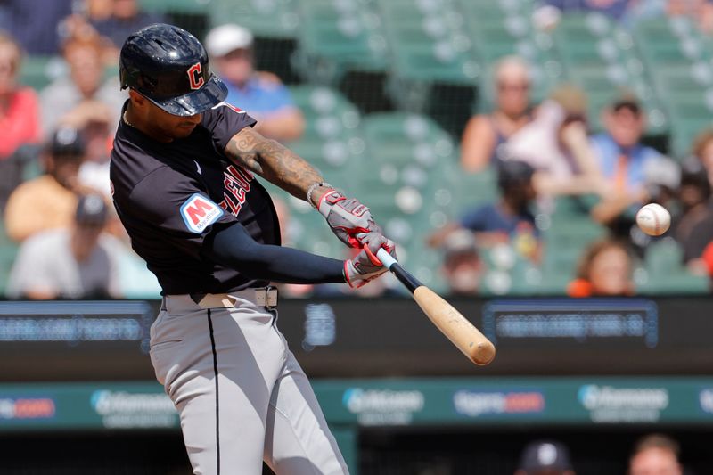 Jul 30, 2024; Detroit, Michigan, USA;  Cleveland Guardians shortstop Brayan Rocchio (4) hits a home run against the Detroit Tigers in the eighth inning at Comerica Park. Mandatory Credit: Rick Osentoski-USA TODAY Sports