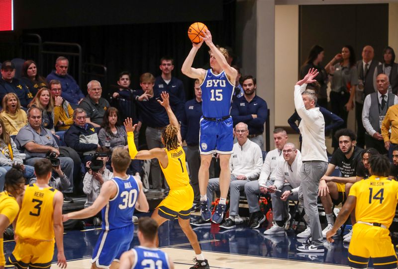 Feb 3, 2024; Morgantown, West Virginia, USA; Brigham Young Cougars guard Richie Saunders (15) shoots a three pointer over West Virginia Mountaineers guard Noah Farrakhan (1) during the first half at WVU Coliseum. Mandatory Credit: Ben Queen-USA TODAY Sports