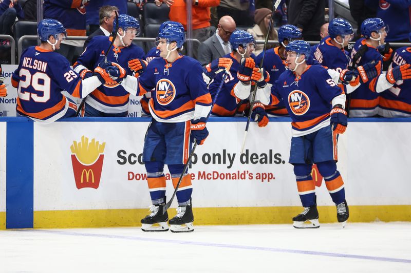 Mar 4, 2025; Elmont, New York, USA;  New York Islanders defenseman Ryan Pulock (6) celebrates with his teammates after scoring a goal in the third period against the Winnipeg Jets at UBS Arena. Mandatory Credit: Wendell Cruz-Imagn Images