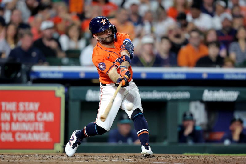 May 23, 2025; Houston, Texas, USA; Houston Astros left fielder Jose Altuve (27) hits a single against the Seattle Mariners during the fifth inning at Daikin Park. Mandatory Credit: Erik Williams-Imagn Images