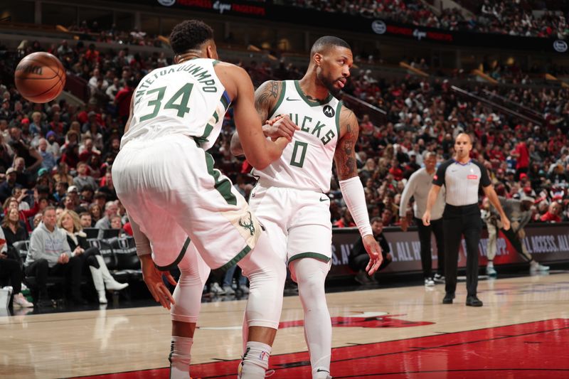 CHICAGO, IL - MARCH 1: Giannis Antetokounmpo #34 of the Milwaukee Bucks is helped up by Damian Lillard #0 during the game against the Chicago Bulls on March 1, 2024 at United Center in Chicago, Illinois. NOTE TO USER: User expressly acknowledges and agrees that, by downloading and or using this photograph, User is consenting to the terms and conditions of the Getty Images License Agreement. Mandatory Copyright Notice: Copyright 2024 NBAE (Photo by Gary Dineen/NBAE via Getty Images)