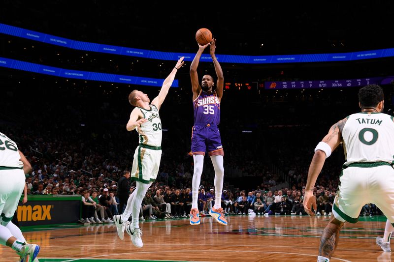 BOSTON, MA - MARCH 14: Kevin Durant #35 of the Phoenix Suns shoots the ball during the game against the Boston Celtics on March 14, 2024 at the TD Garden in Boston, Massachusetts. NOTE TO USER: User expressly acknowledges and agrees that, by downloading and or using this photograph, User is consenting to the terms and conditions of the Getty Images License Agreement. Mandatory Copyright Notice: Copyright 2024 NBAE  (Photo by Brian Babineau/NBAE via Getty Images)